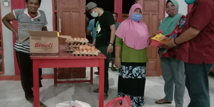 Pemdes Sinandaka Sambut Baik Bantuan Sembako dari Pemda Bolsel