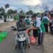 Pakai Sarung Khas Nahdliyin, PAC GP Ansor Posigadan Bagikan Takjil dan Masker
