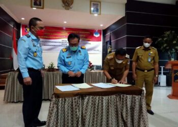 Kanwil Kemenkumham dan Pemkab Boltim Teken MoU Produk Hukum