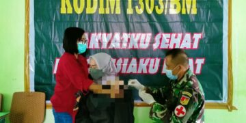 Istri Kepala BP2MI Ikut Vaksinasi di Kodim 1303 Bolmong
