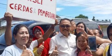 Jemput Penjabat Bupati Bolmong, Ribuan Warga Padati Perbatasan Poigar-Minsel