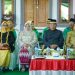 Tampak Bupati Bolmut, Drs. H Depri Pontoh bersama Wakil Bupati Bolmut, Drs. H. Amin Lasena, MAP, saat menghadiri tradisi adat Mopohabaru (Foto : Istimewa)