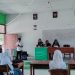 Foto : Anggota PPK Kaidipang, Nolla Mokoginta didamping PPS, saat melakukan sosialisasi