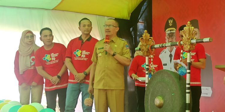 Hadiri HKN ke 59, Pj Wali Kota Kotamobagu Asripan Nani Launching SI ASRI