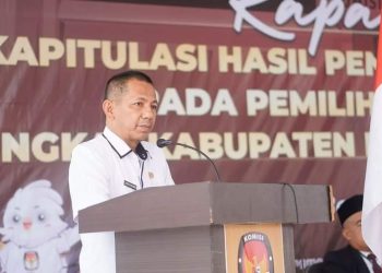 Foto : Sekretaris Daerah Bolmut, dr. Jusnan C Mokoginta, saat membacakan sambutan Pj Bupati Bolmut