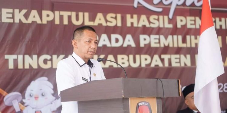 Foto : Sekretaris Daerah Bolmut, dr. Jusnan C Mokoginta, saat membacakan sambutan Pj Bupati Bolmut