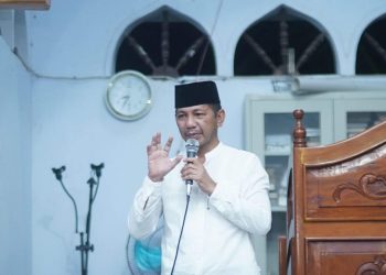 Foto : Sekretaris Daerah dr. Jusnan C. Mokoginta, MARS, saat menyampaikan sambutan Pemda Bupati di acara Nuzul Qur'an dan Safari Ramadhan