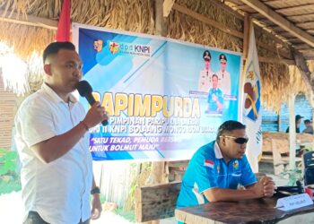 Foto : Ketua Panitia Pelaksana Musda Ke-IV KNPI Bolmut, Rifki Tegila saat menyampaikan laporannya pada pelaksanaan Rapimpurda